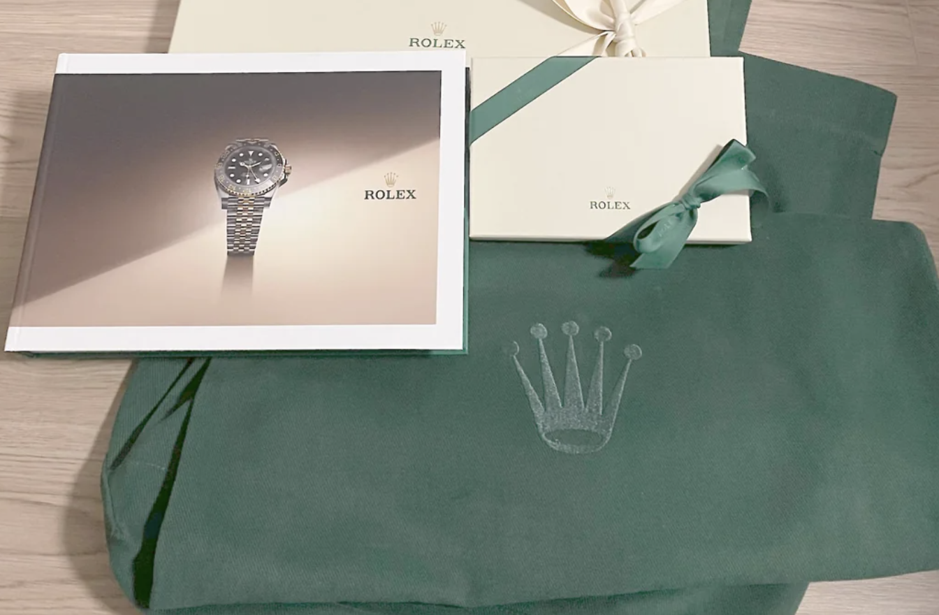 image of rolex invitations and bag