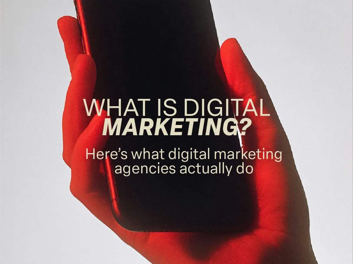 what-is-digital-marketing-poster Hand holding a smartphone with the text "What is Digital Marketing? Here’s what digital marketing agencies actually do"