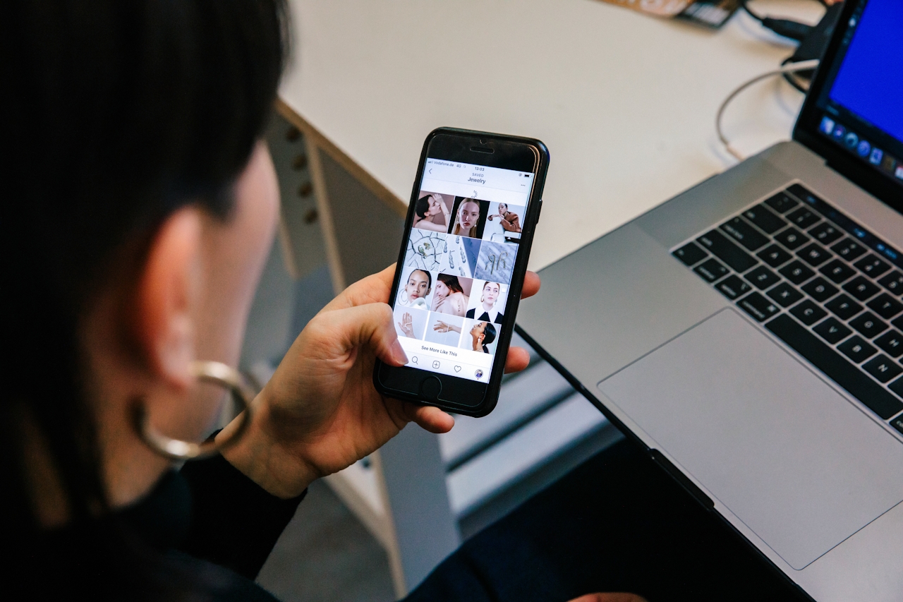 image of woman at social media marketing agency in melbourne looking through instagram grid